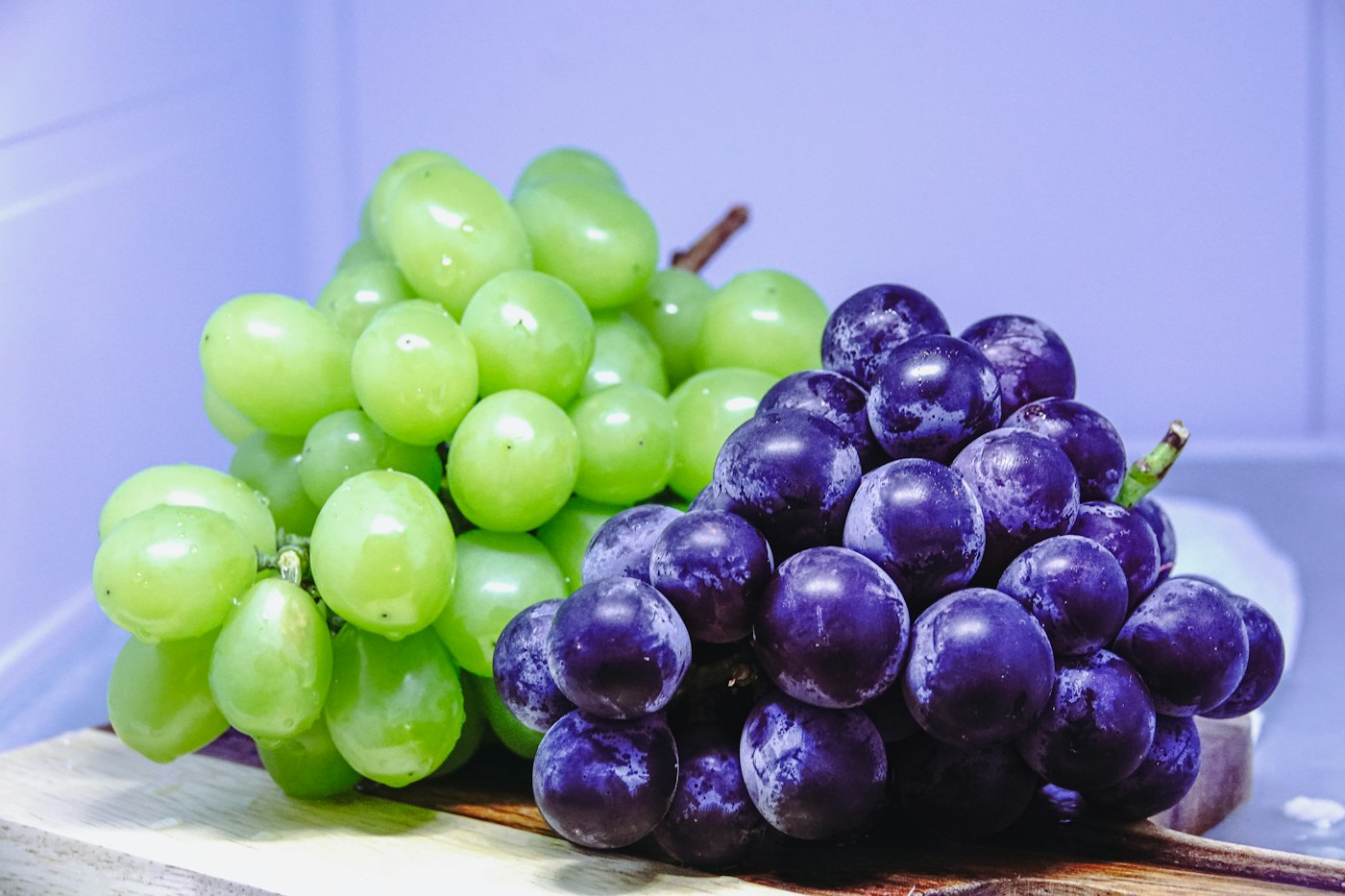 A bunch of whole green and red grapes