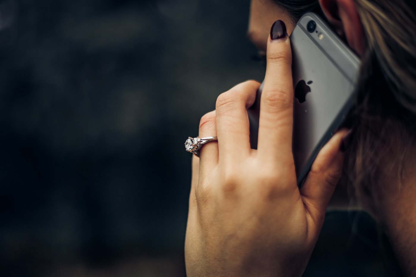 A woman holding a mobile phone to her ear